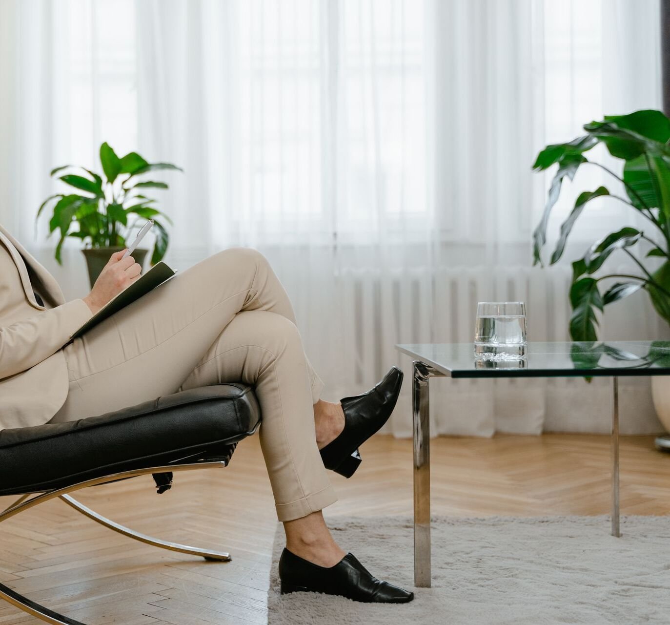 Therapy office showing a female therapist having a session with a client